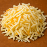 Image of shredded Munster cheese.