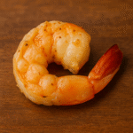 Image is a seasoned cooked shrimp.
