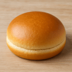 Image of a plain hamburger bun.