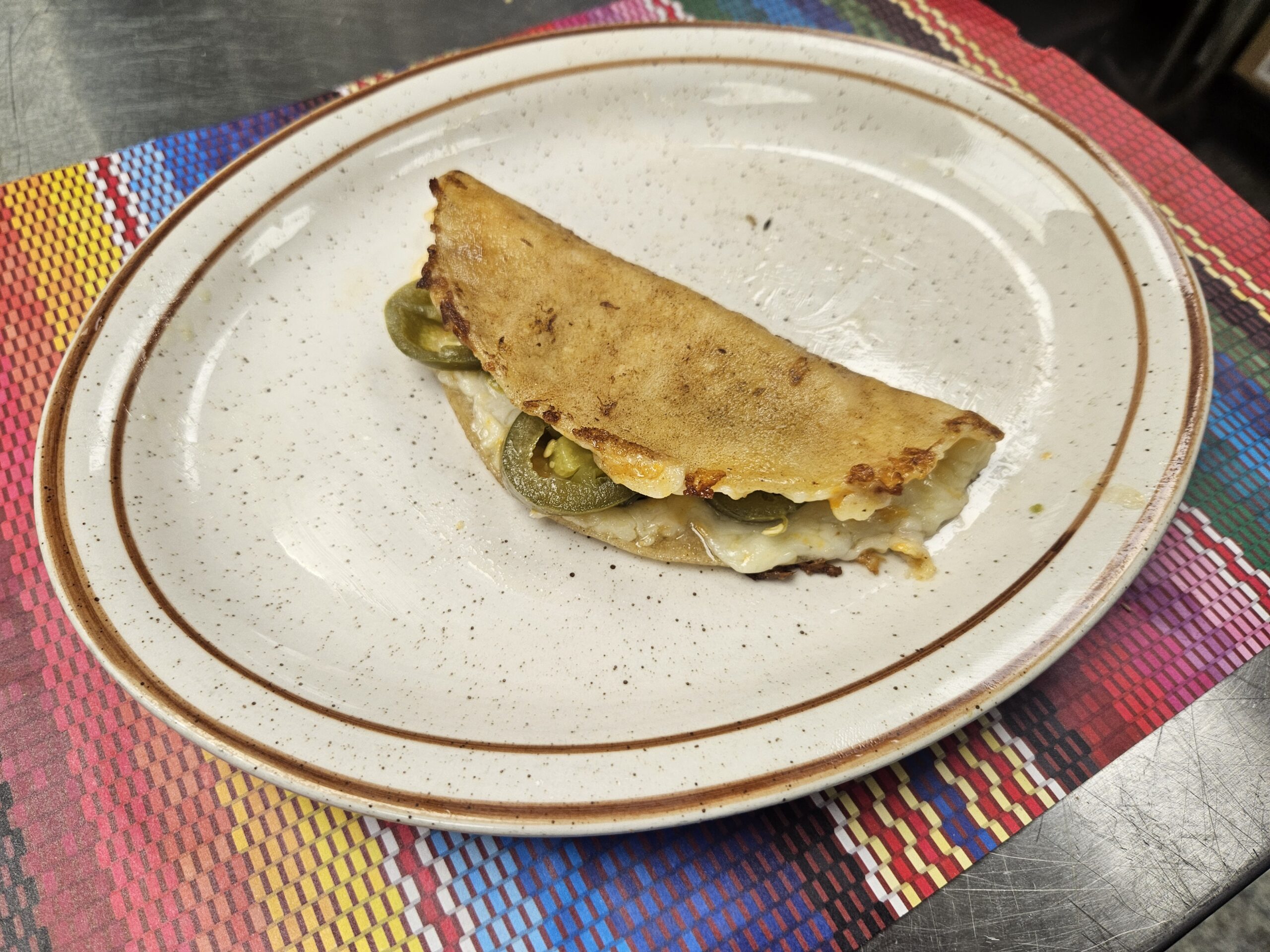 This is an image of a quesadilla taco at Manuel's taco hut.
