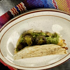 This is an image of a Nacho Taco at Manuels Taco Hut