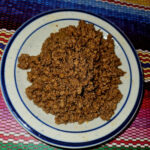 This is an image of ground beef at Manuel's Taco Hut.