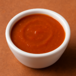 An image of hot sauce in a bowl.